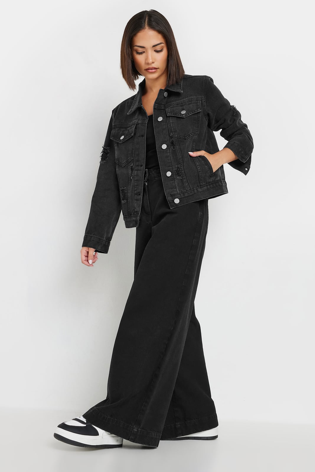 Black Distressed Denim Jacket With Wide Leg Jeans, Close-Up Take Black Distressed Denim Jacket With Wide Leg Jeans, Close-Up Take — Distressed Denim Jacket Outfits 2027