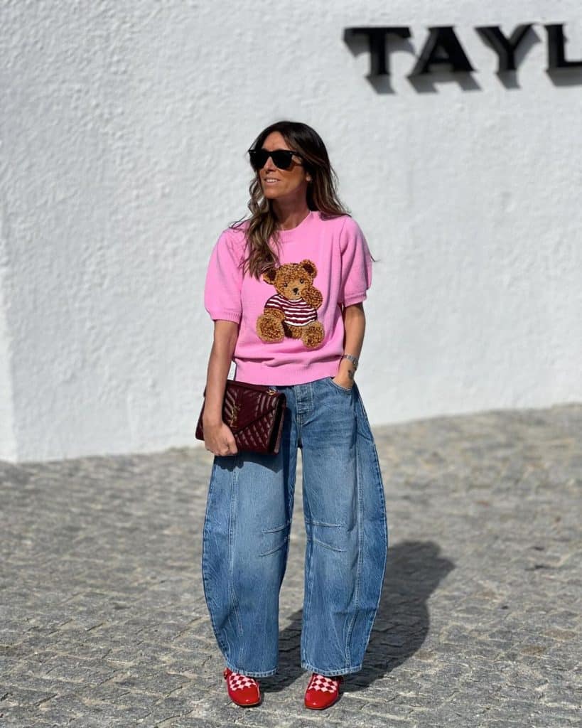 Medium wash barrel jeans with a graphic sweater Medium wash barrel jeans with a graphic sweater — Barrel Jeans 2027