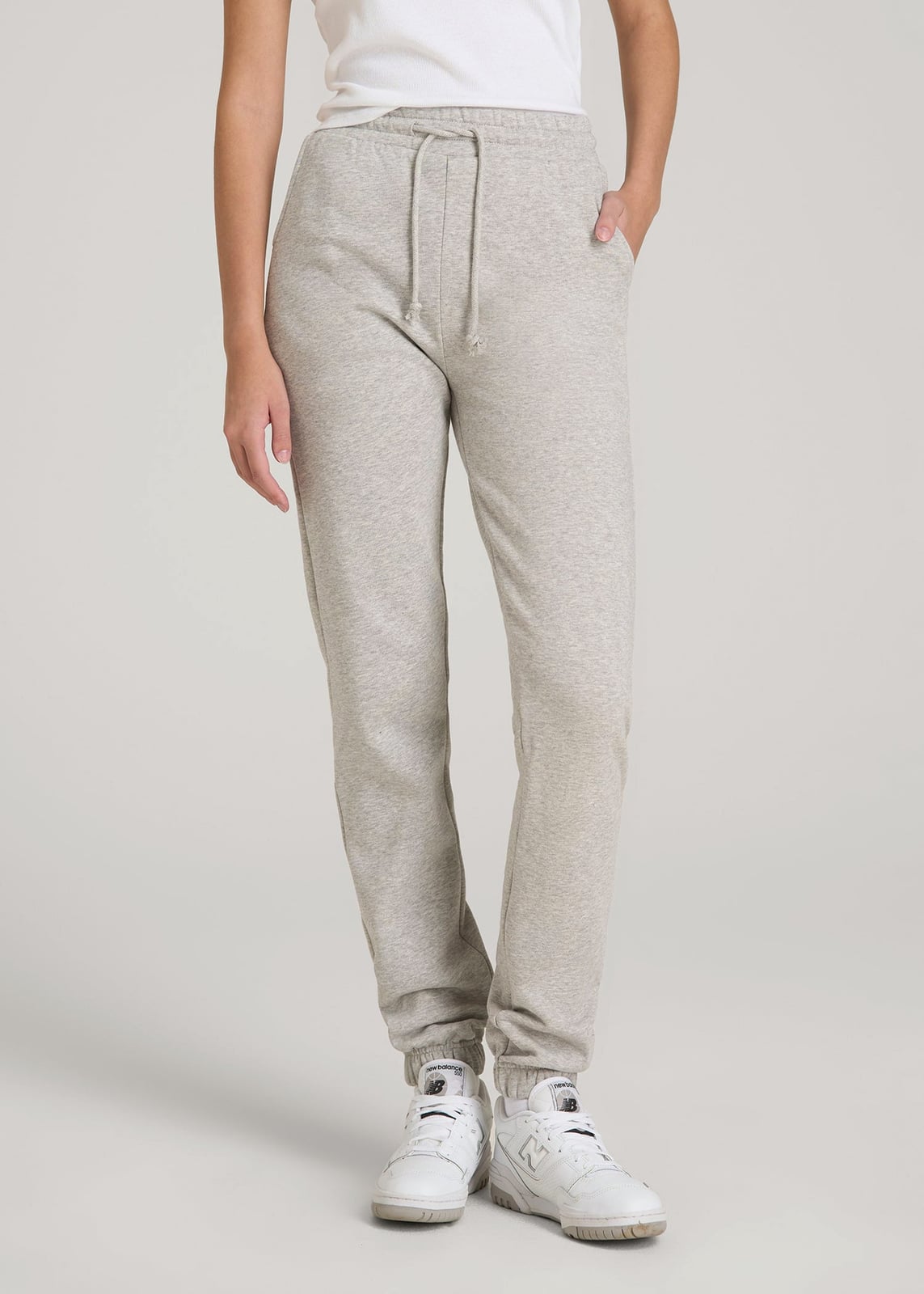 Light Gray Joggers With White T-Shirt and Sneakers, Close-Up Take Light Gray Joggers With White T-Shirt and Sneakers, Close-Up Take — Gray Joggers Outfits 2027