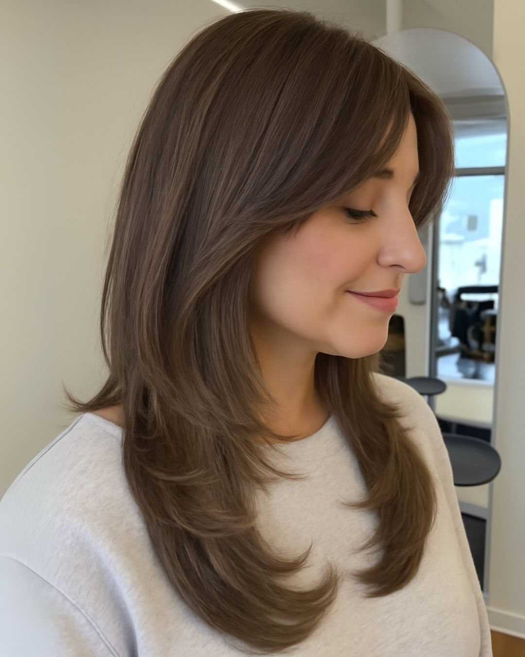 Layered Lob With Side-Swept Bangs Layered Lob With Side-Swept Bangs — Winter Haircuts 2027 for Square Faces